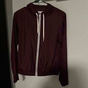 Lightweight purple windbreaker. Full zipper in the front. Purple.